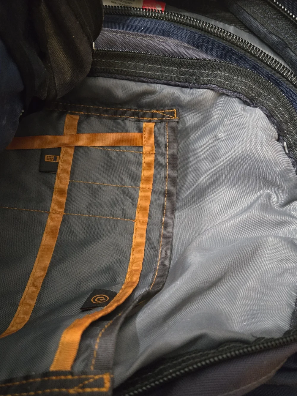The North Face Slingshot Backpack in Navy and Charcoal